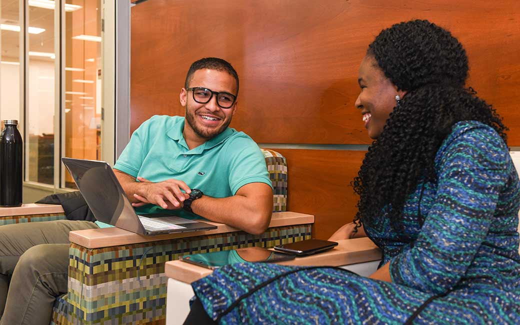 two graduate students in library