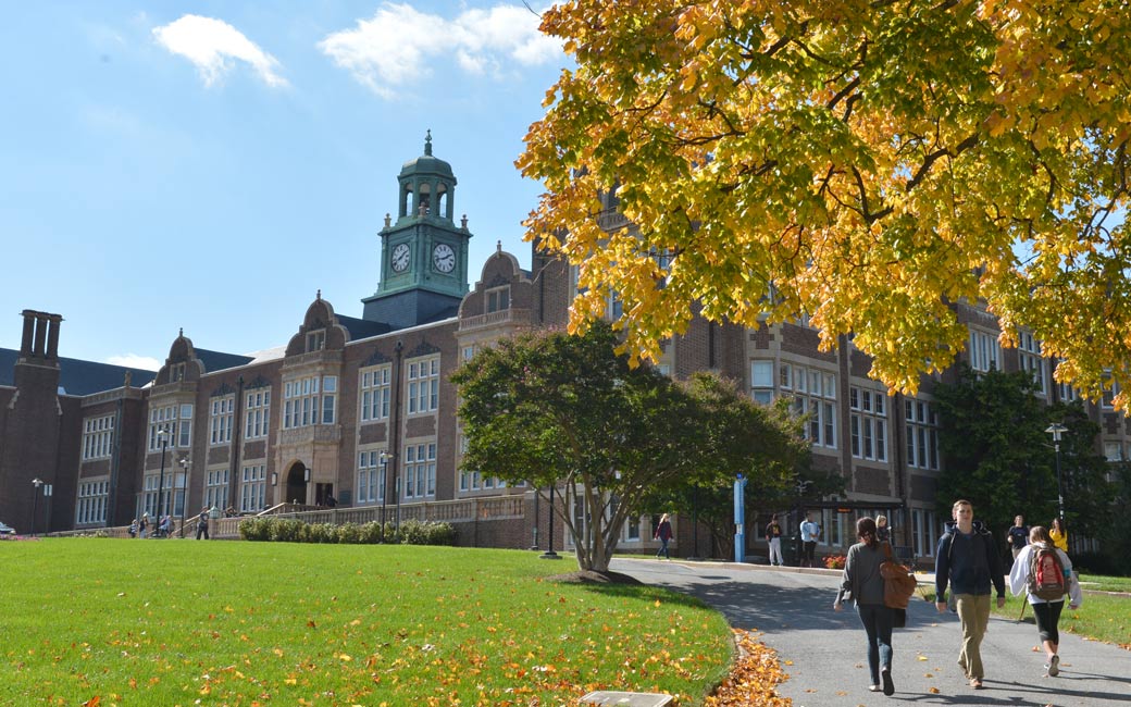 students walking on campus in front of Stephens Hall