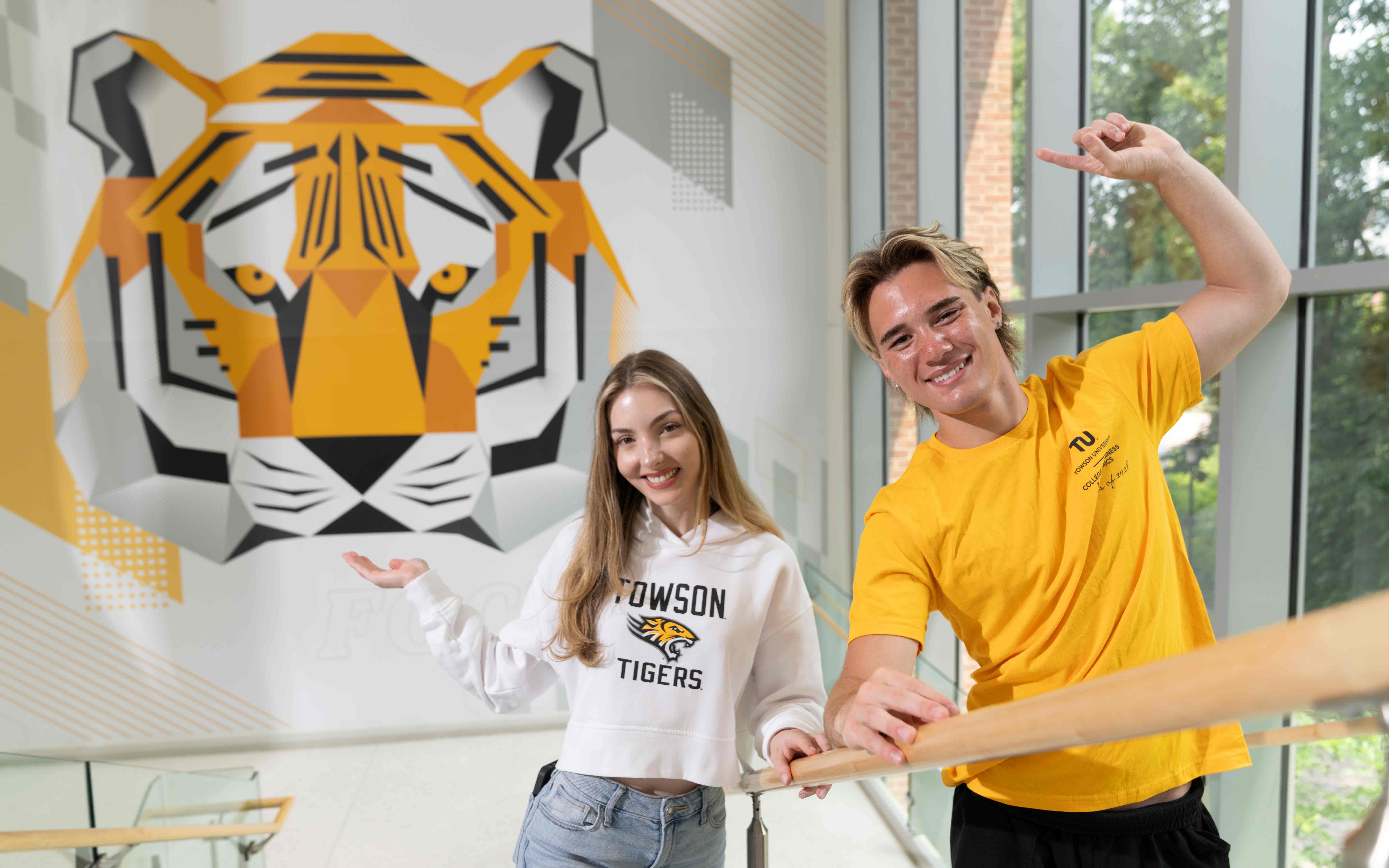 Students with tiger mural