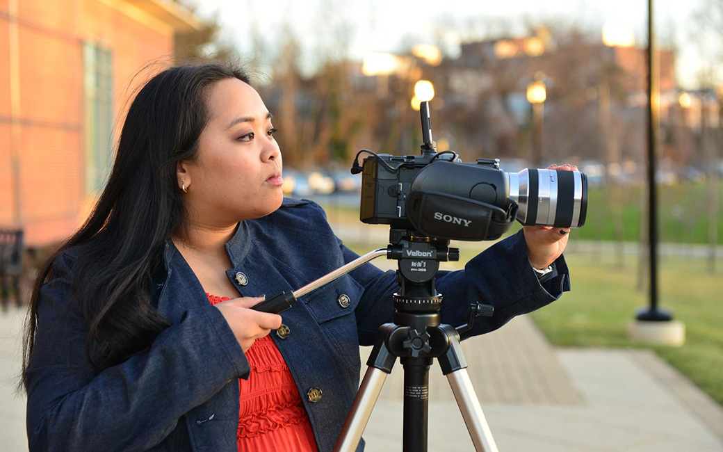 Student filming outside on campus