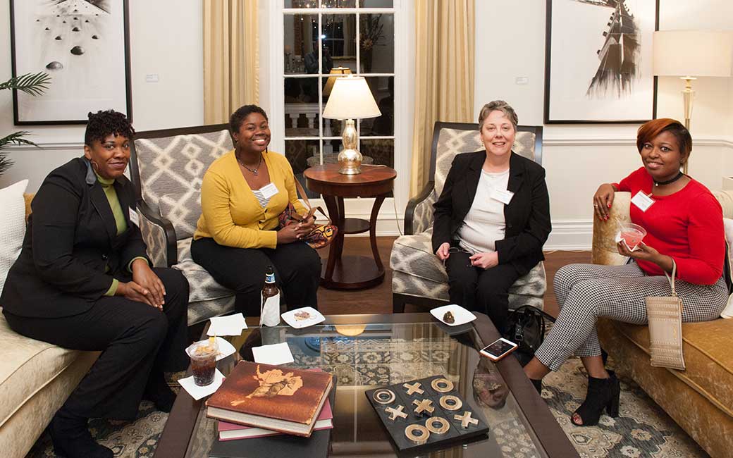 female accounting alums sitting and talking at an accounting department alumni event