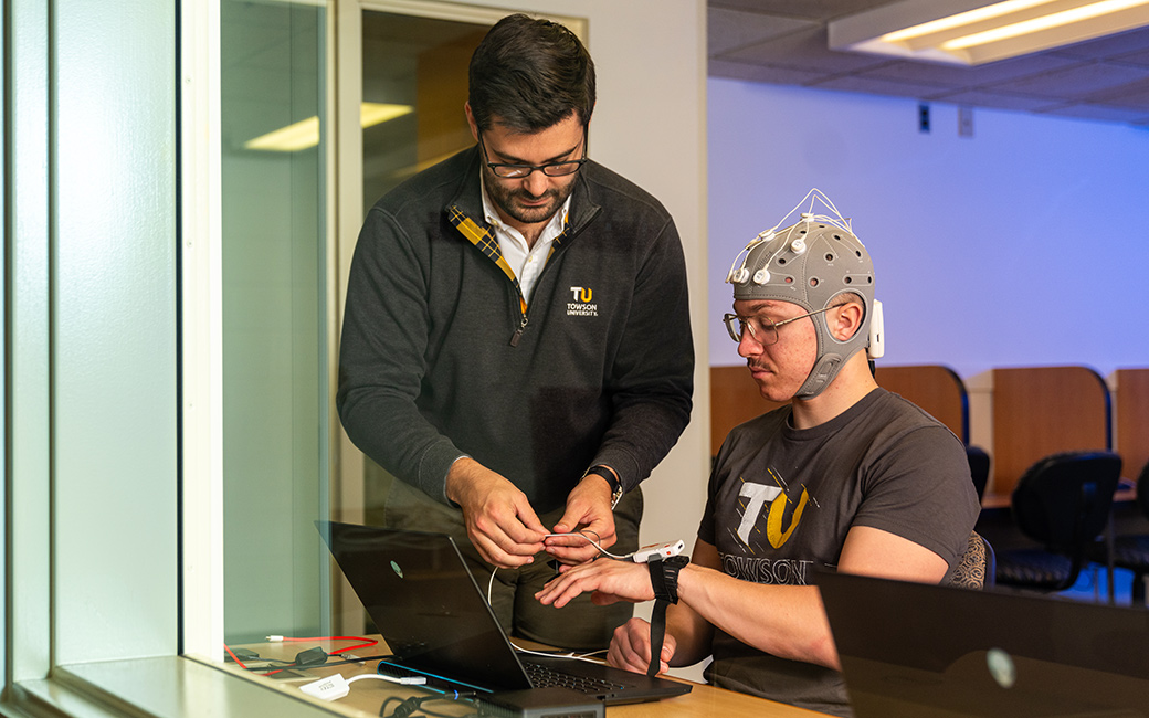 student and professor in the behavioral lab