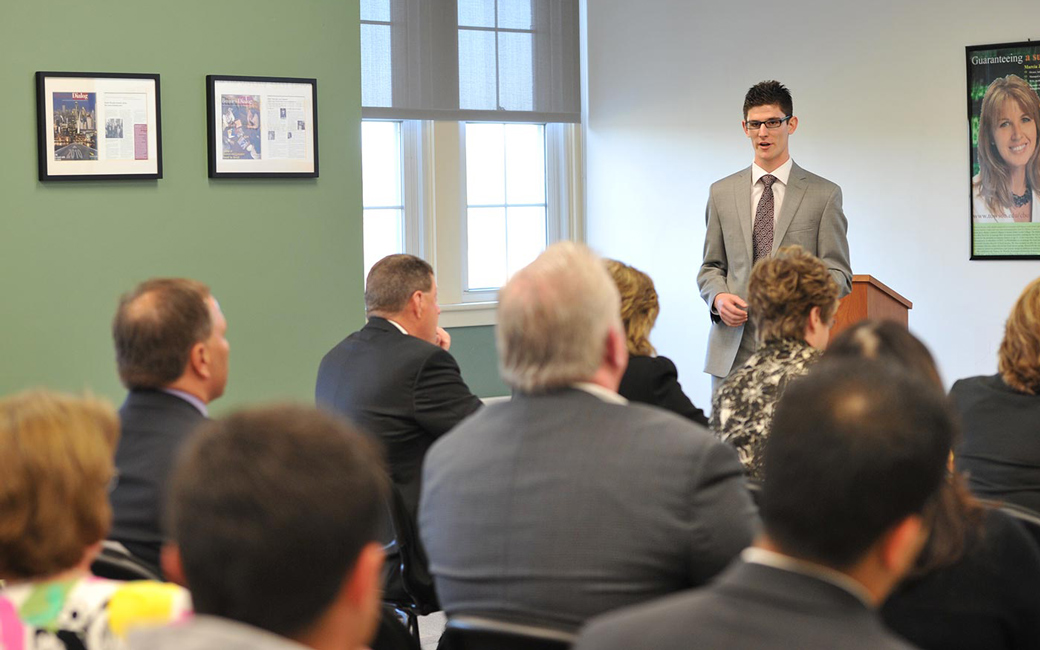 Towson University College of Business and Economics student giving a business presentation