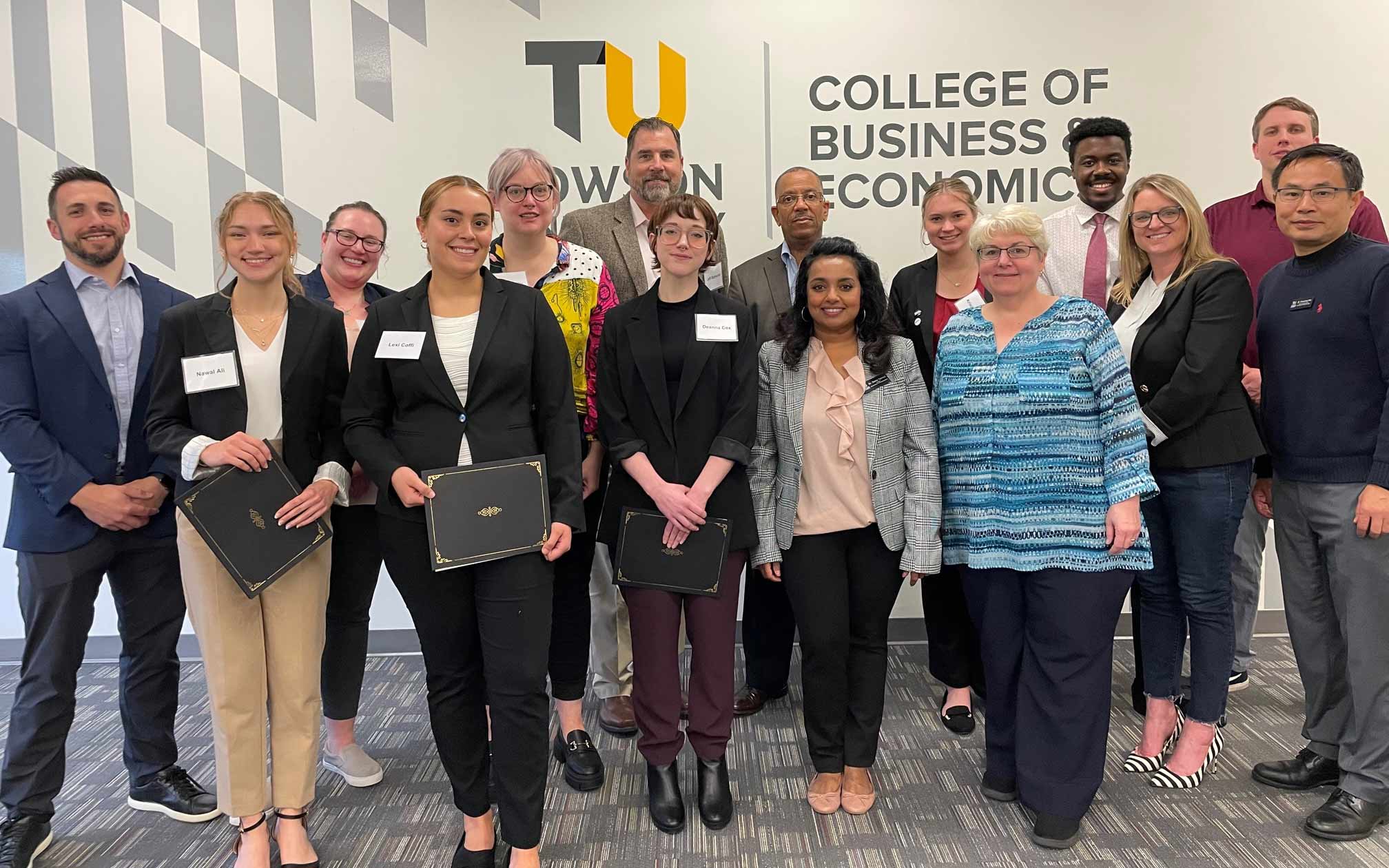 Students pose with faculty and company sponsors