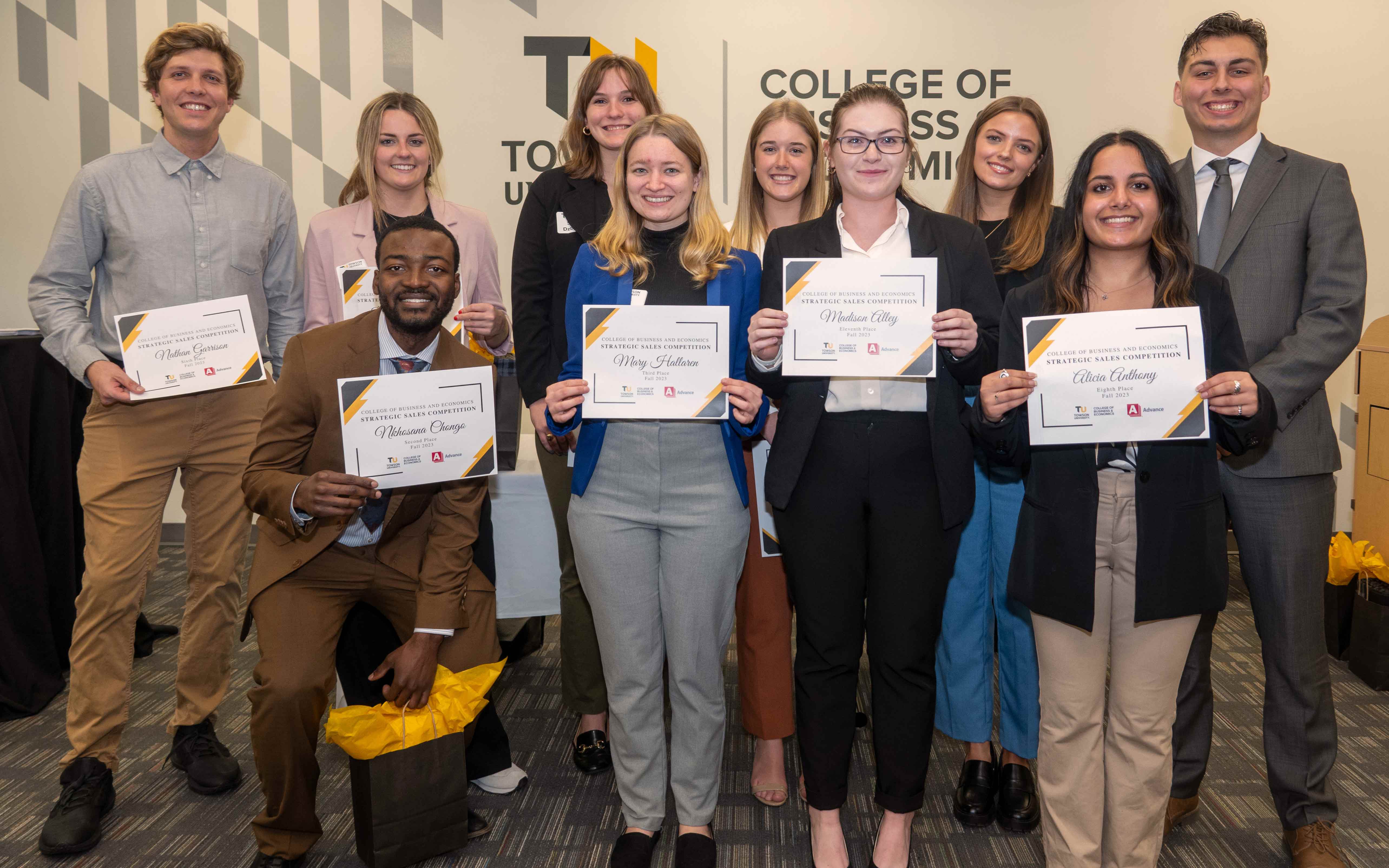 Students pose with certificates