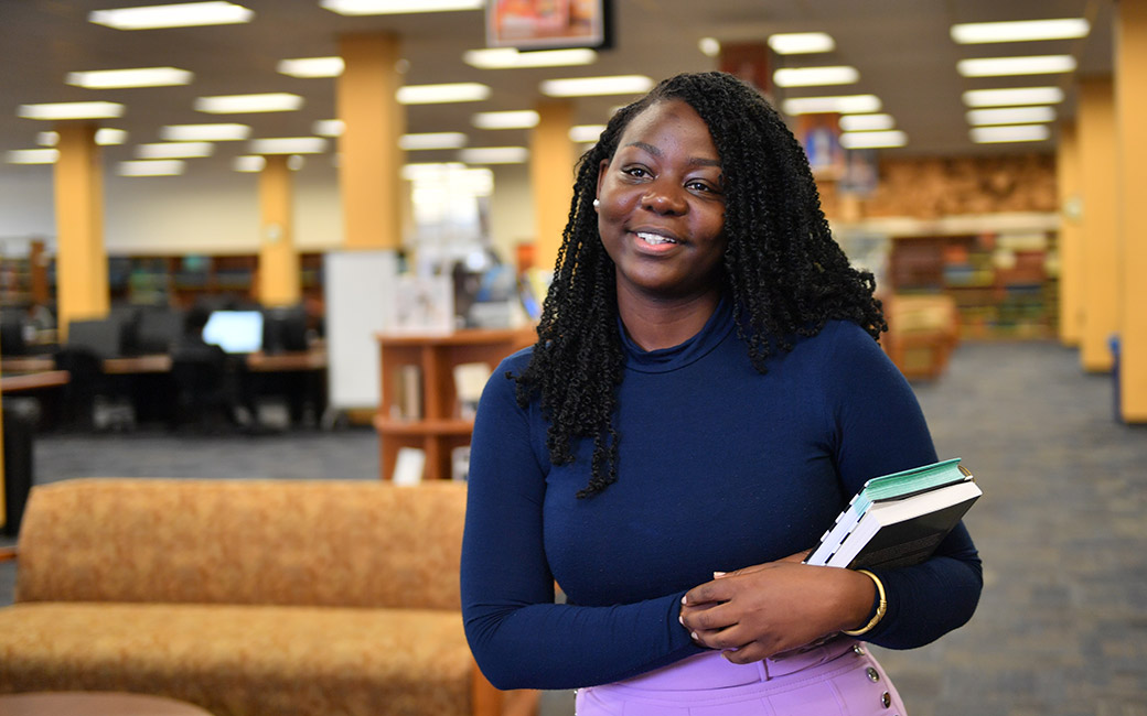 Martha Kakooza in library