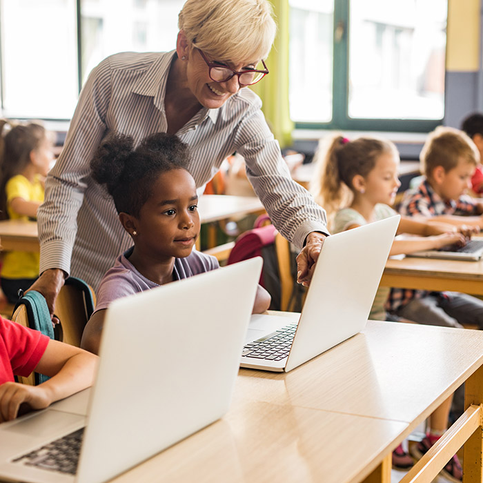 Teacher teaching a class using technology