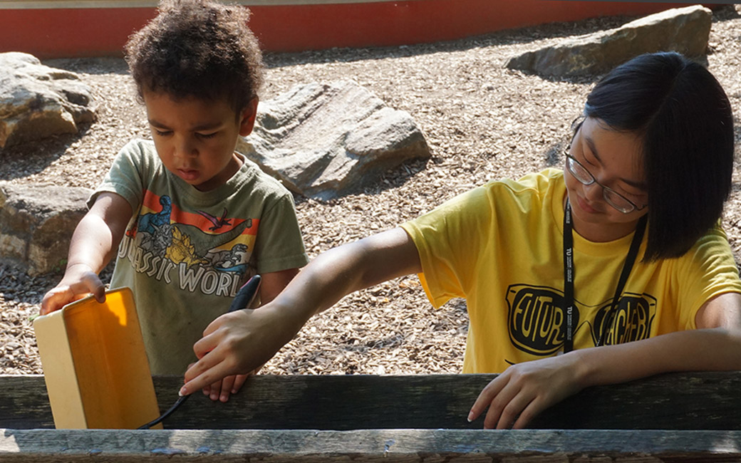 student with child at child care center