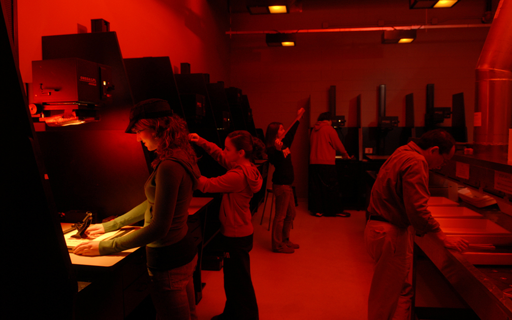 photography students working in wet darkroom