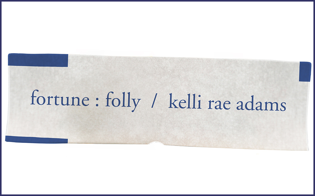 Exhibition title in blue text on white background resembling a fortune cookie slip