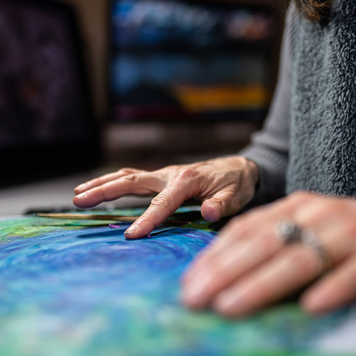 Lynn Tomlinson's hands working on animation