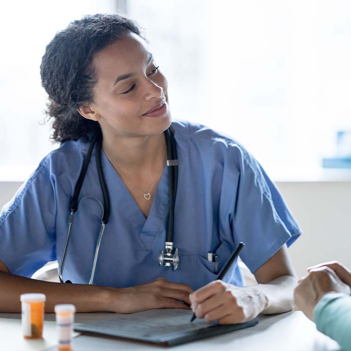 Medical assistant giving an injection