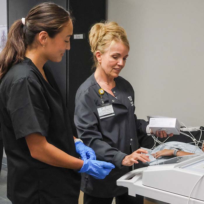 Students using the EKG with the course instructor