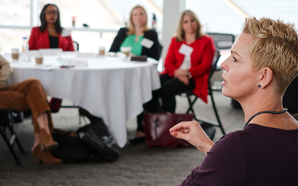 Alumna speaking to the group