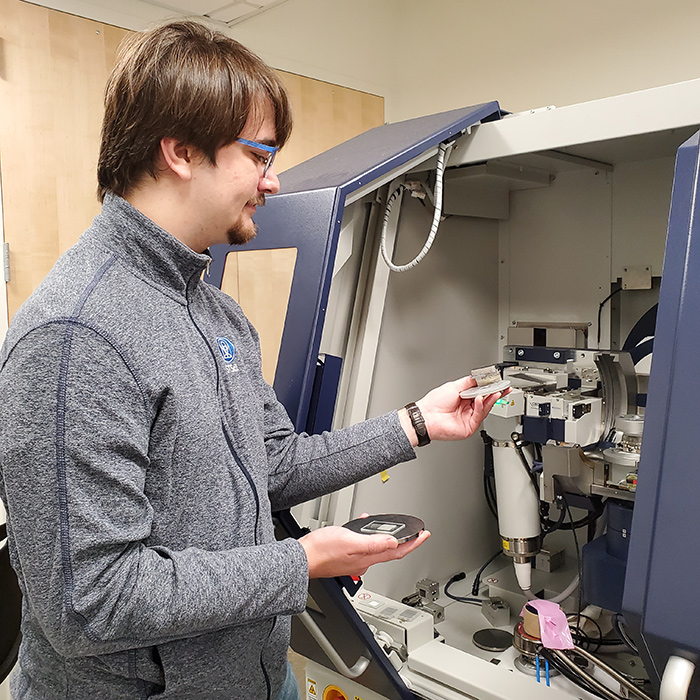 student and professor next to x-ray diff