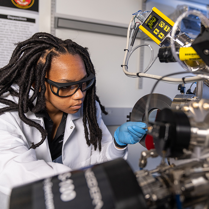 student working at cryostat