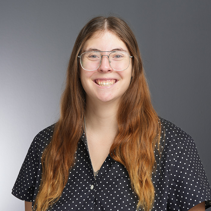 Staff member headshot showing a smiling person.