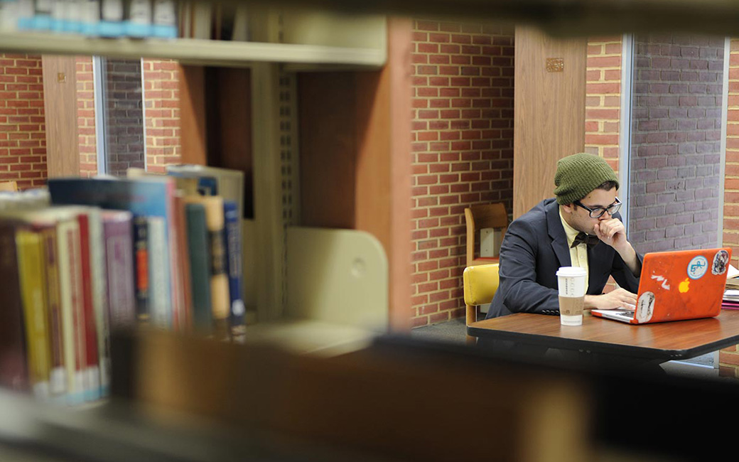 student in library