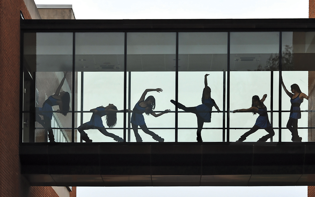 dancers through a window