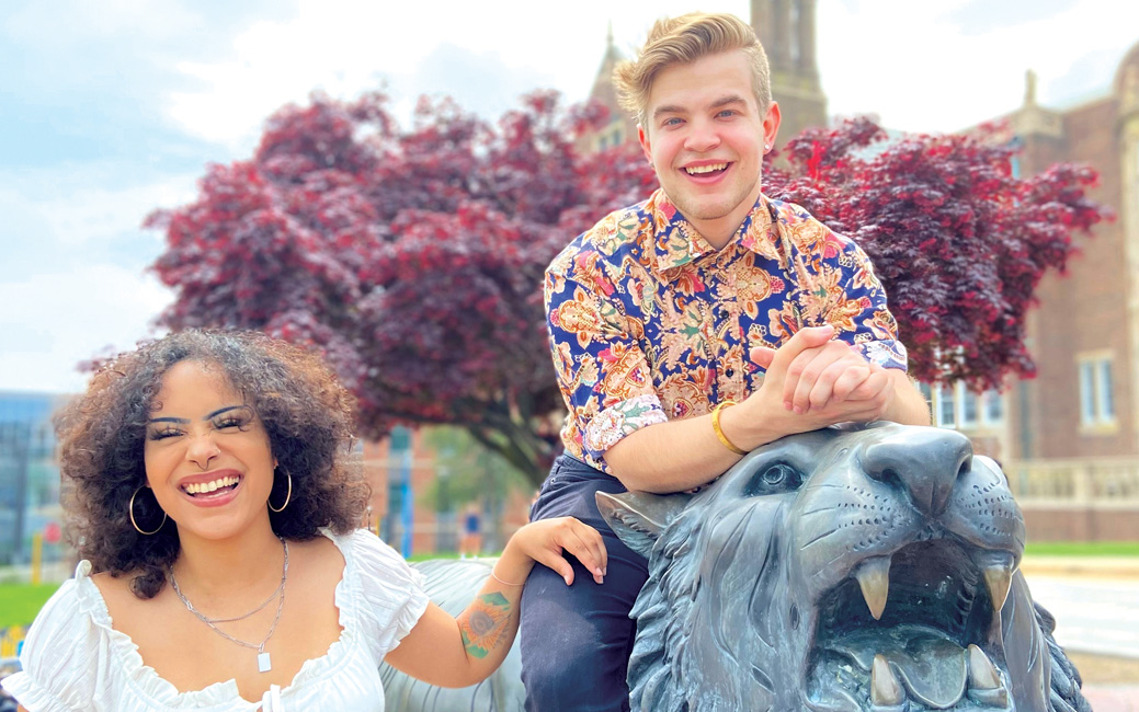 Soon-to-be alumni pose at the Stephens Hall tiger. 
