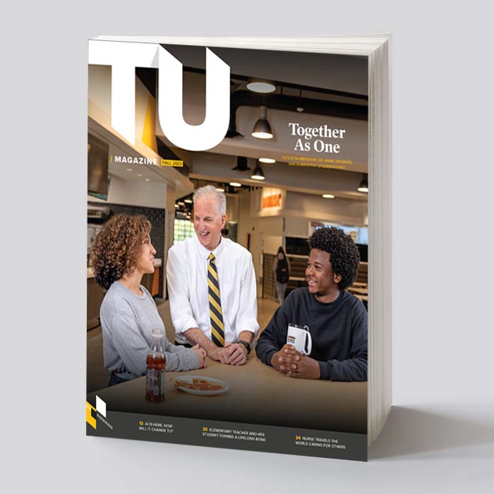 Cover of the issue with Dr. Ginsberg and two students.
