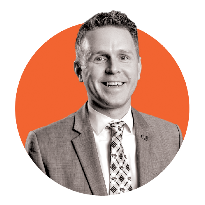 Man's headshot inside an orange circle