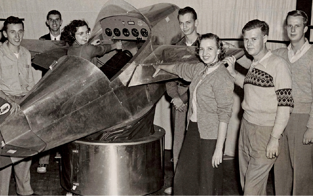 Students with an old plane