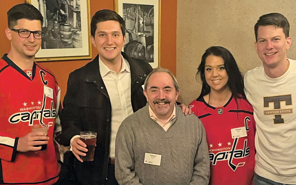Alumni and friends sport their Capitals jerseys and Tigers gear.