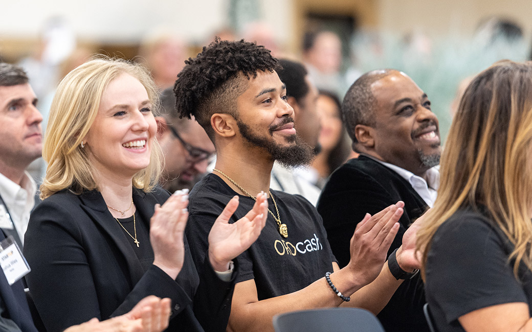 close up of people in audience clapping