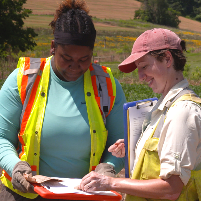 Women speaking in field