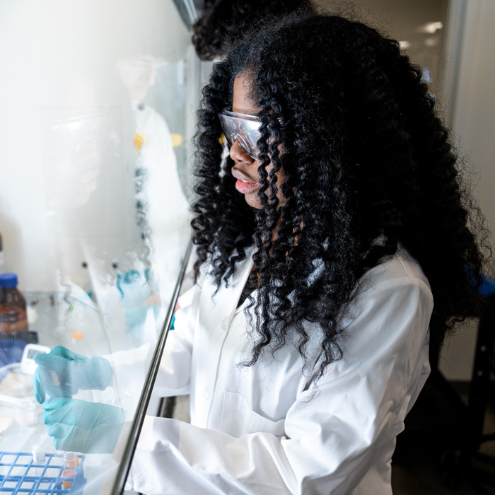 A student looking at water samples in the Aqueous Environmental Chemistry Laboratory 