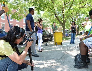 Filming a community clean up