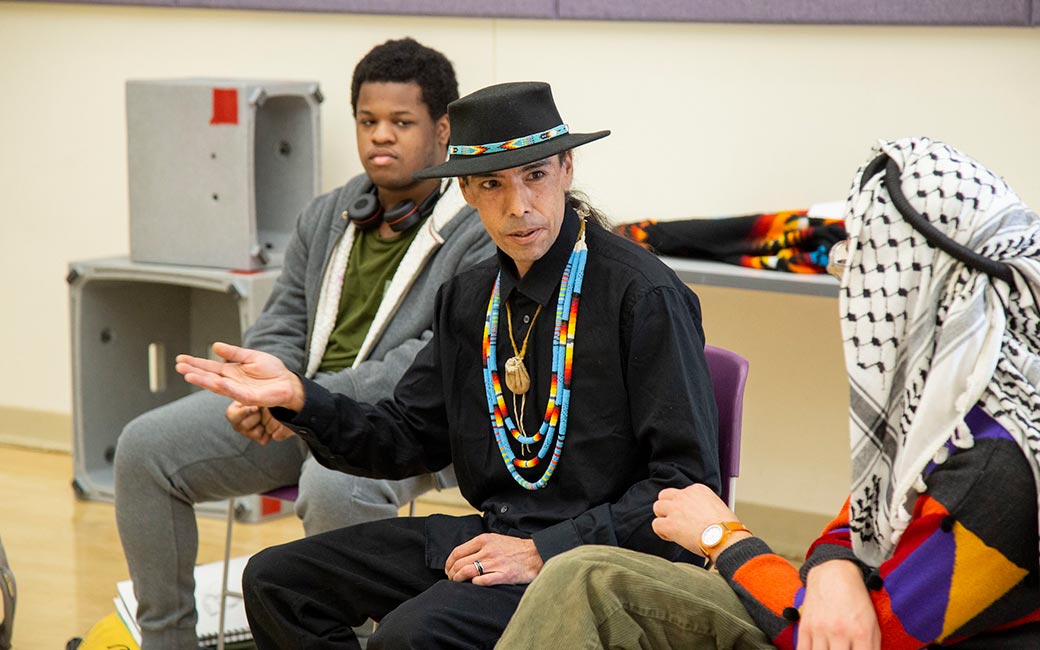 Person speaks with students