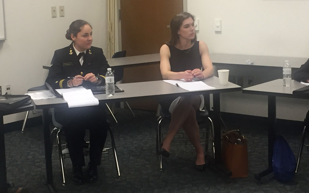 Senior Towson University gymnast Lauren Cahalan, right, and the Naval Academy's Alexis Opferman, sit in the Nimitz Library during the Naval Academy Foreign Affairs Conference.