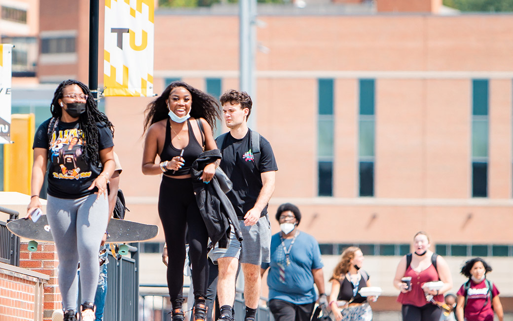 Students on walkway with banners