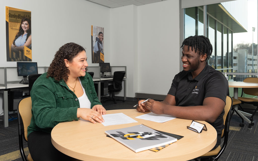 Two students sitting in the Career Center