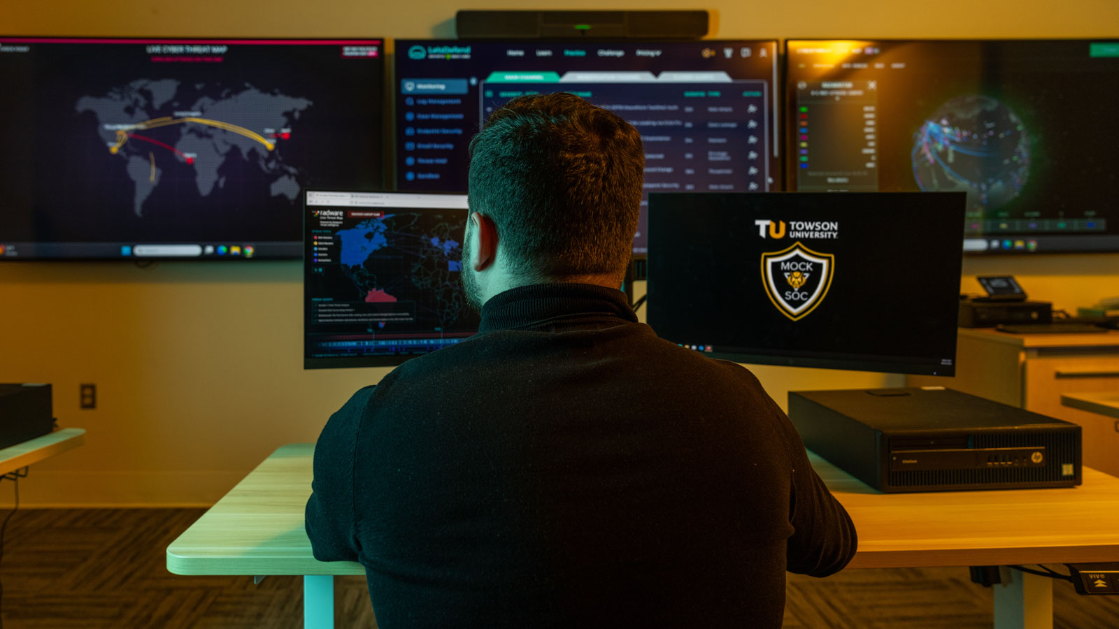 Towson University senior Cory Burns does cyber security research in one of TU's cyber lab