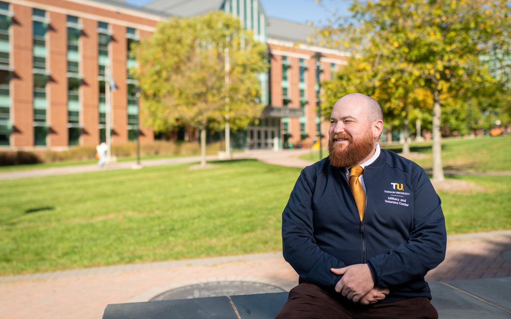Dario DiBattista sitting on campus