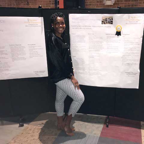 Elssa Kenfack with her poster