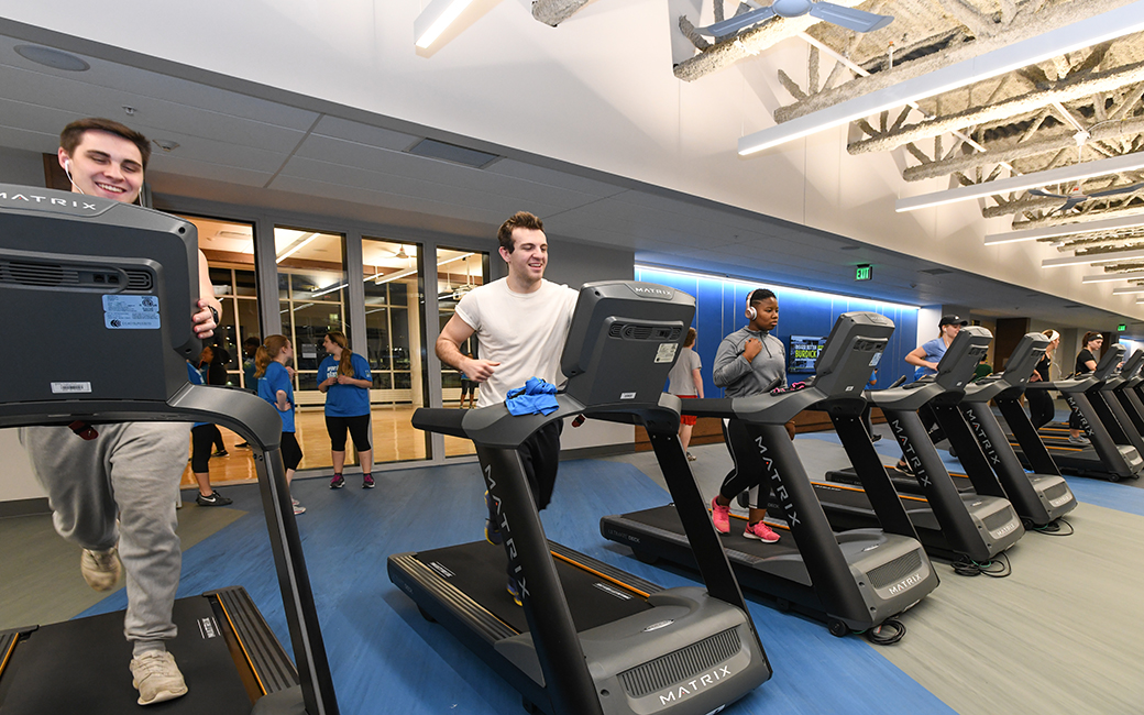 Three men on treadmills