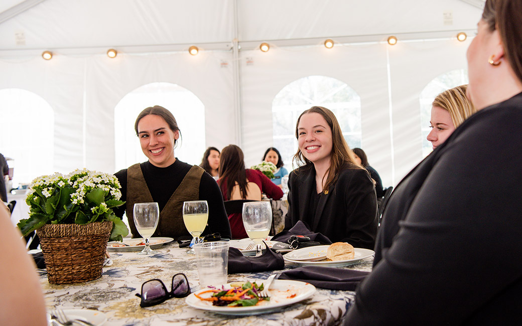 People sitting around table dining