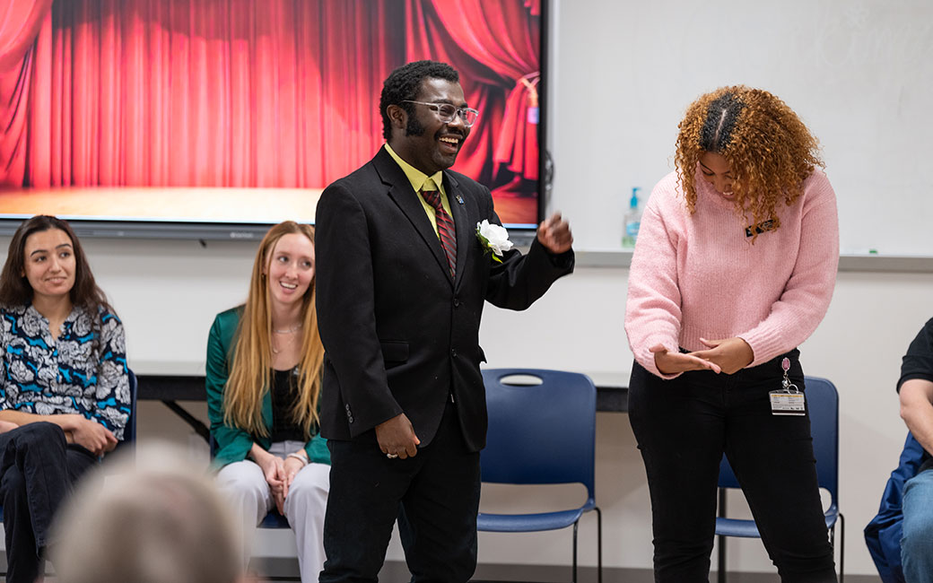 Student performing improv during a showcase