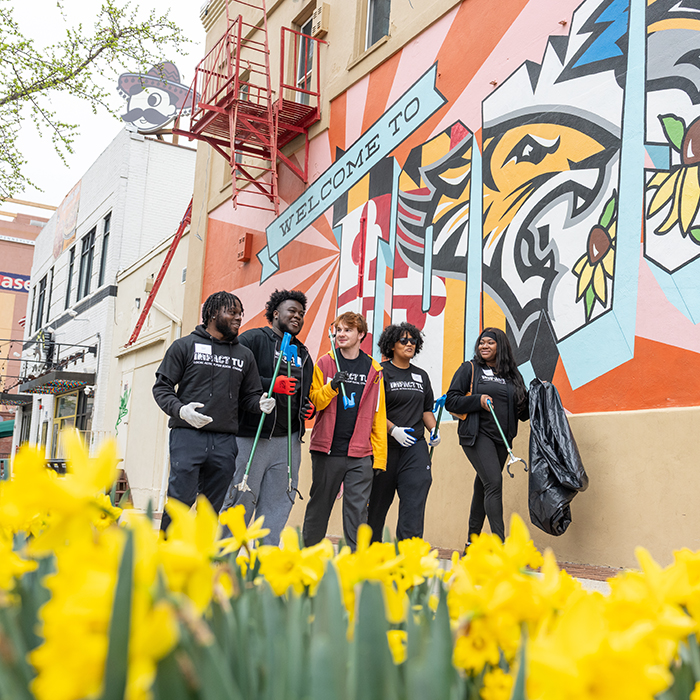 students volunteering for Impact TU