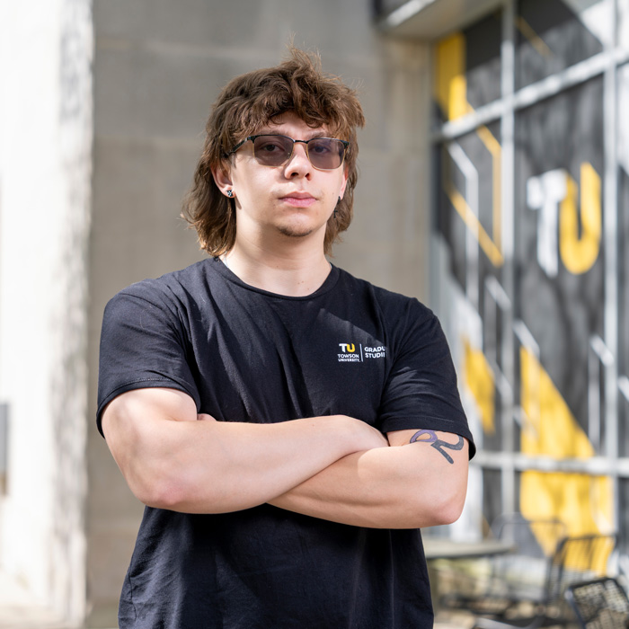 Kyle Langenfelder posing outside of the Administration Building