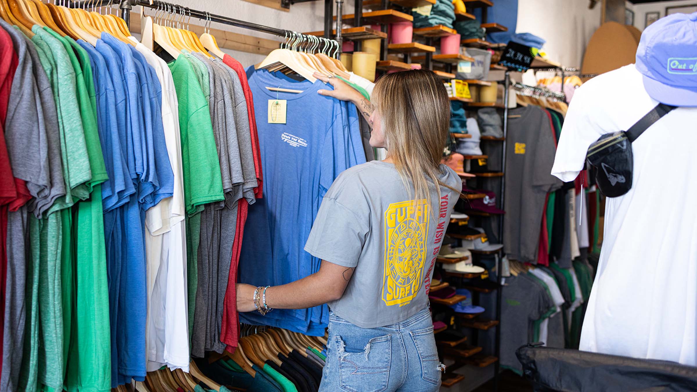 Abby MacQueen examines a clothing rack