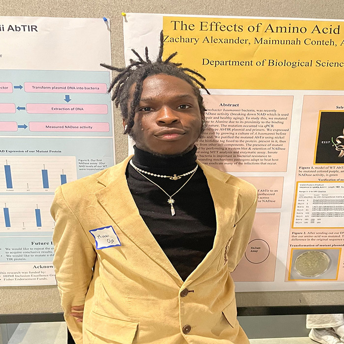 Person standing in front of research poster