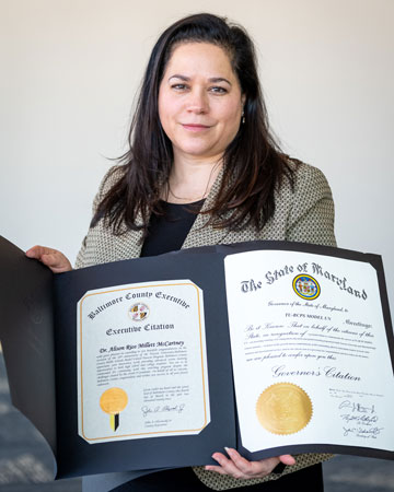 Professor Alison McCartney holding Model UN Citations