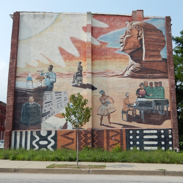 Collage mural of imagery from throughout time beginning in Ancient Egypt
