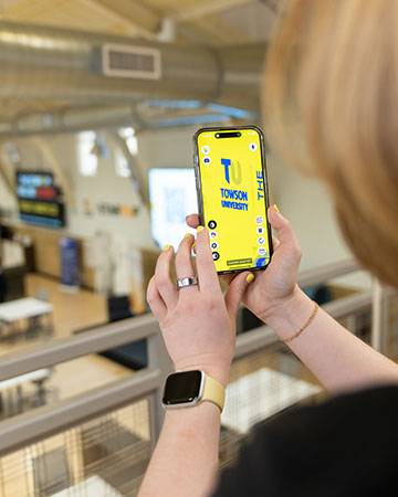 Using camera feature on the phone with the app to change the visuals of the TU logo.