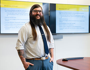 Jimmy Thren in front of his SOS presentation.